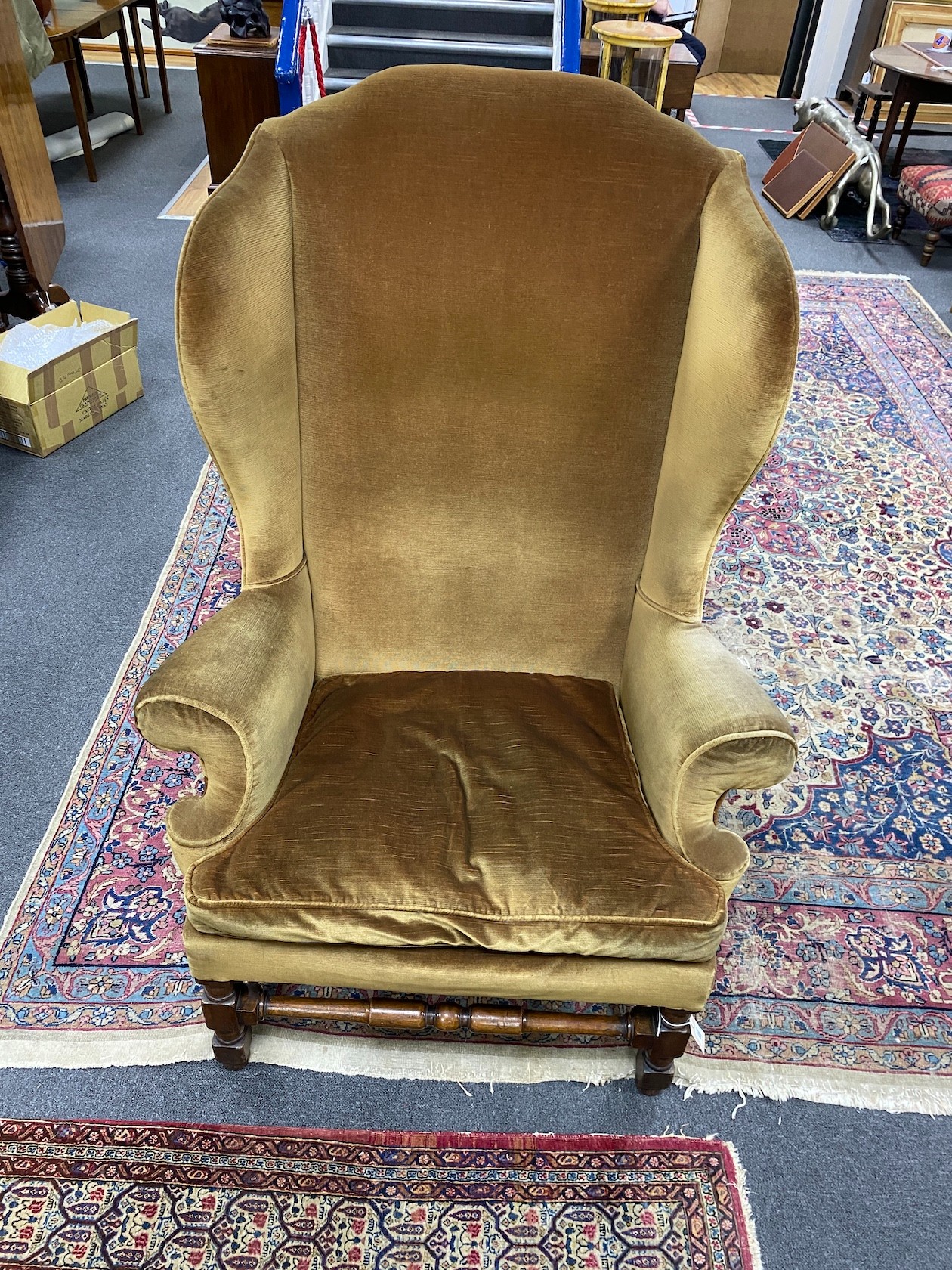 A French Louis XIV walnut wingback armchair